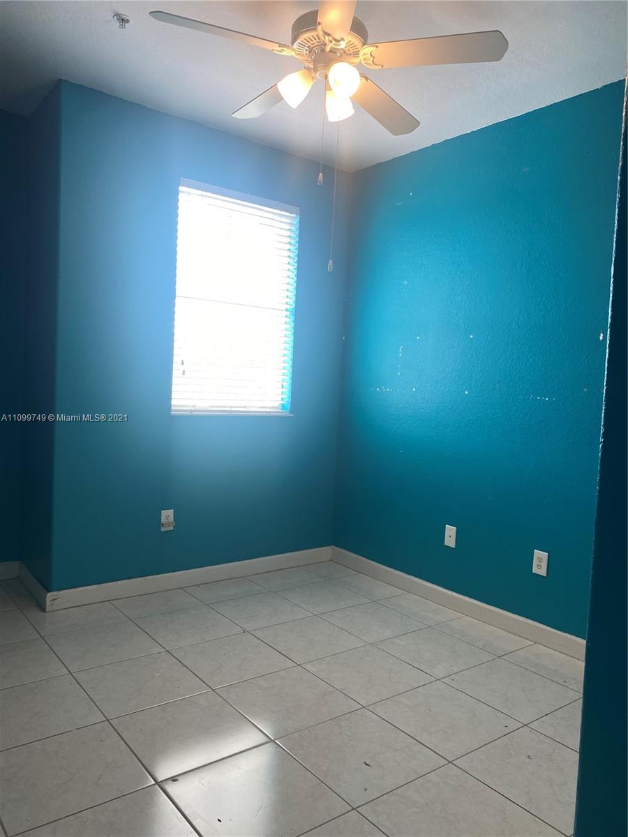 Hialeah Hialeah, FL 33018 - Photo 19 of 27 en empty room with windows and fan