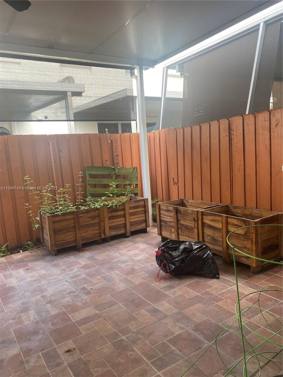 Hialeah Hialeah, FL 33018 - Photo 25 of 27 a view of a backyard with furniture and a garage