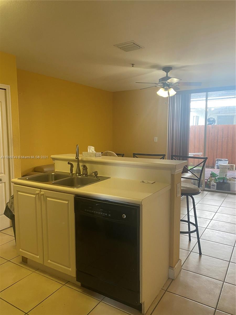 Hialeah Hialeah, FL 33018 - Photo 5 of 27 a view of a kitchen with a sink and cabinets
