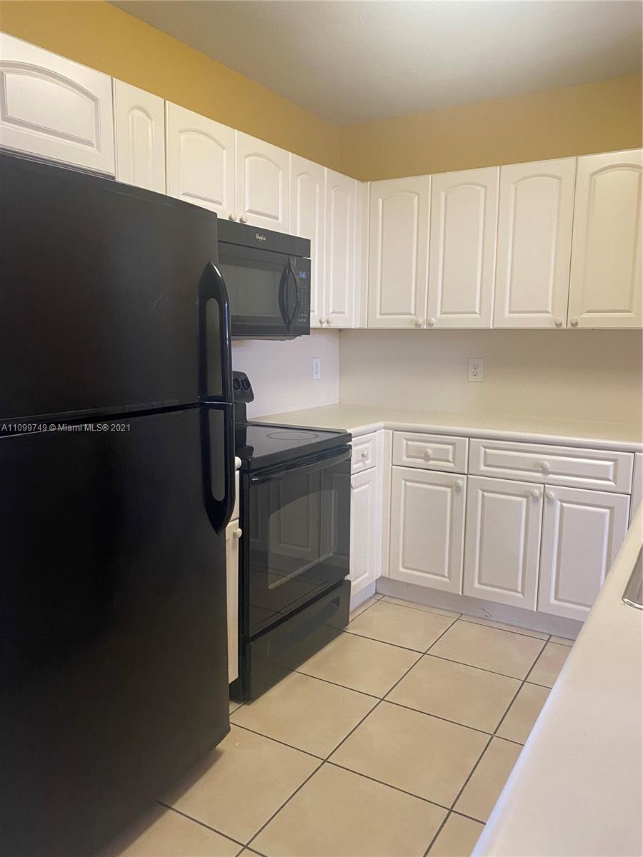 Hialeah Hialeah, FL 33018 - Photo 6 of 27 a kitchen with a sink cabinets and appliances