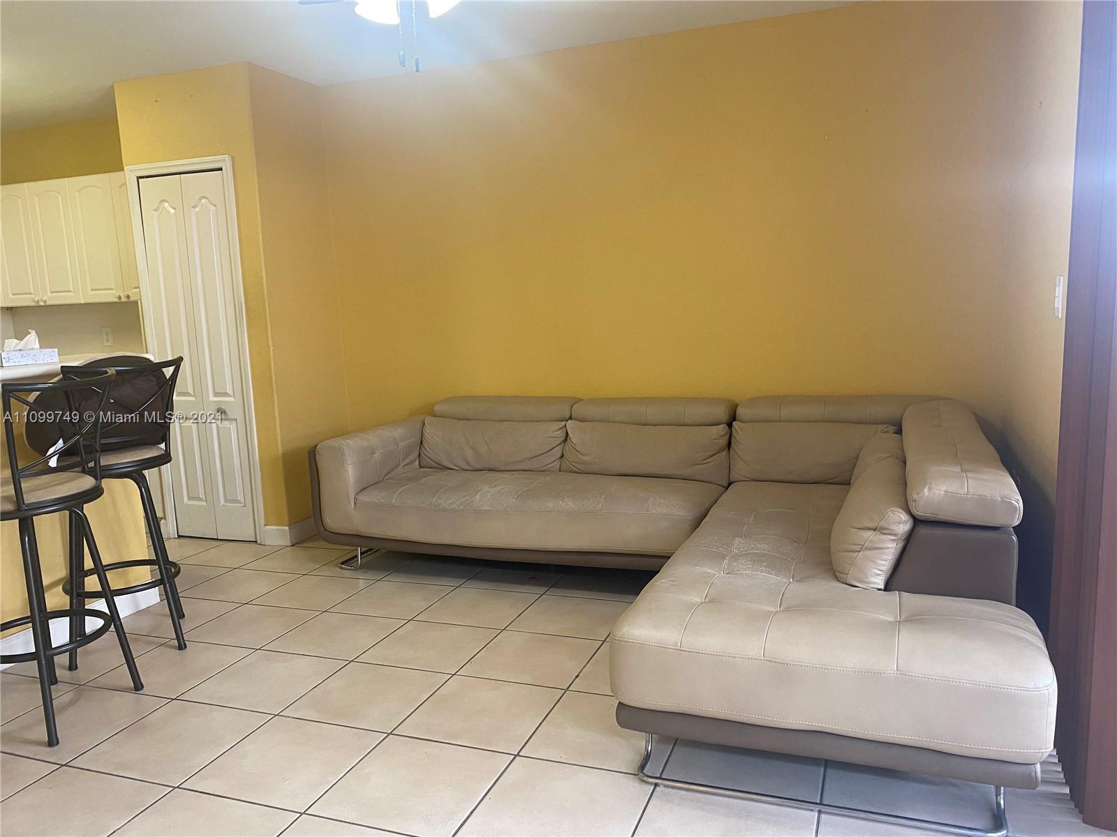 Hialeah Hialeah, FL 33018 - Photo 9 of 27 a bedroom with a bed and chair