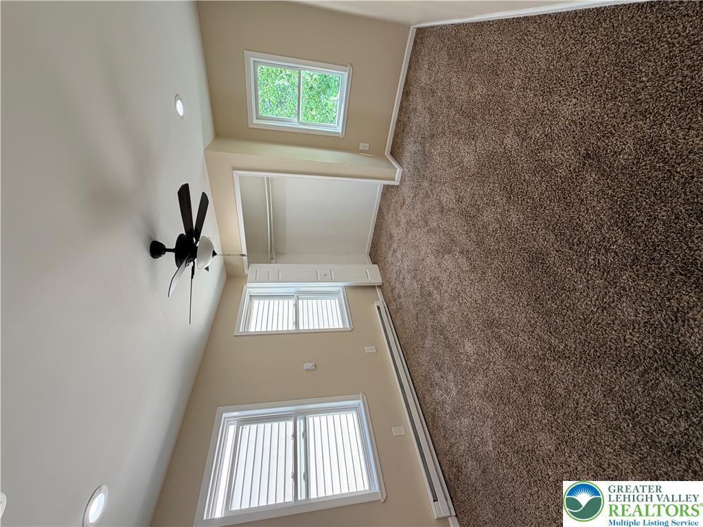718 Ferry Street Easton, PA 18042 - Photo 11 of 37 Plush carpeting and vaulted ceilings create a serene and open atmosphere.