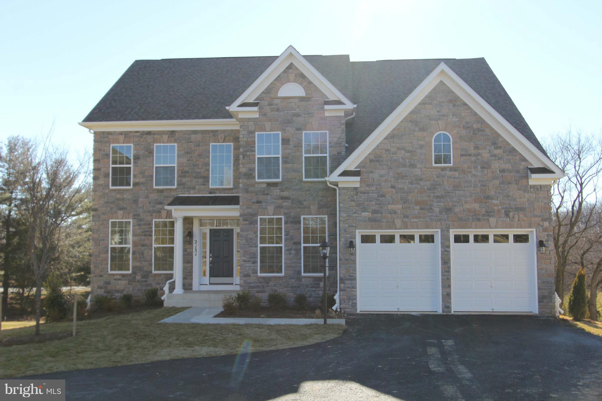 2131 Fairland Road Silver Spring, MD 20904 - Photo 1 of 1 a front view of a house with a garden and plants
