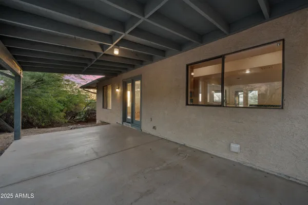 a view of a room with porch and windows