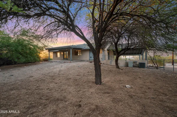 a house with trees in front of it