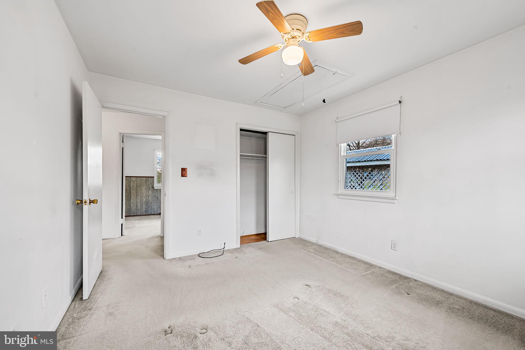 9382 North Laurel Road Laurel, MD 20723 - Photo 17 of 31 an empty room with closet and fan