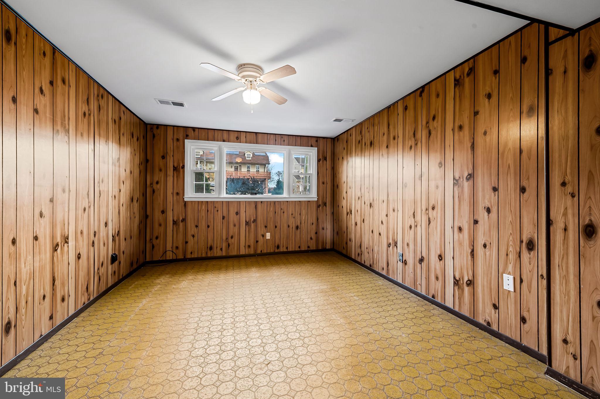 9382 North Laurel Road Laurel, MD 20723 - Photo 24 of 31 a view of an empty room with wooden floor and a window