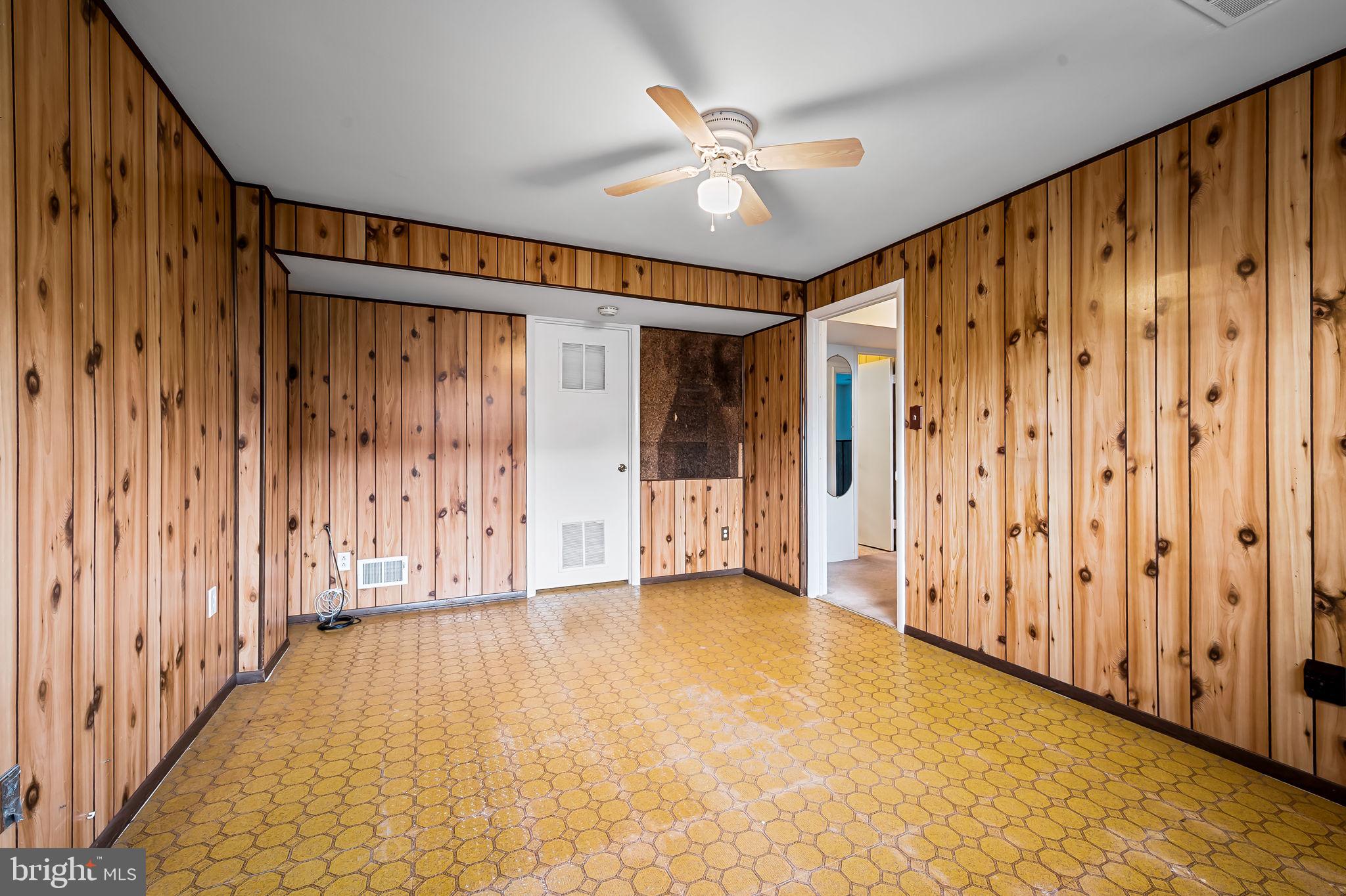 9382 North Laurel Road Laurel, MD 20723 - Photo 25 of 31 a view of a hallway with wooden walls