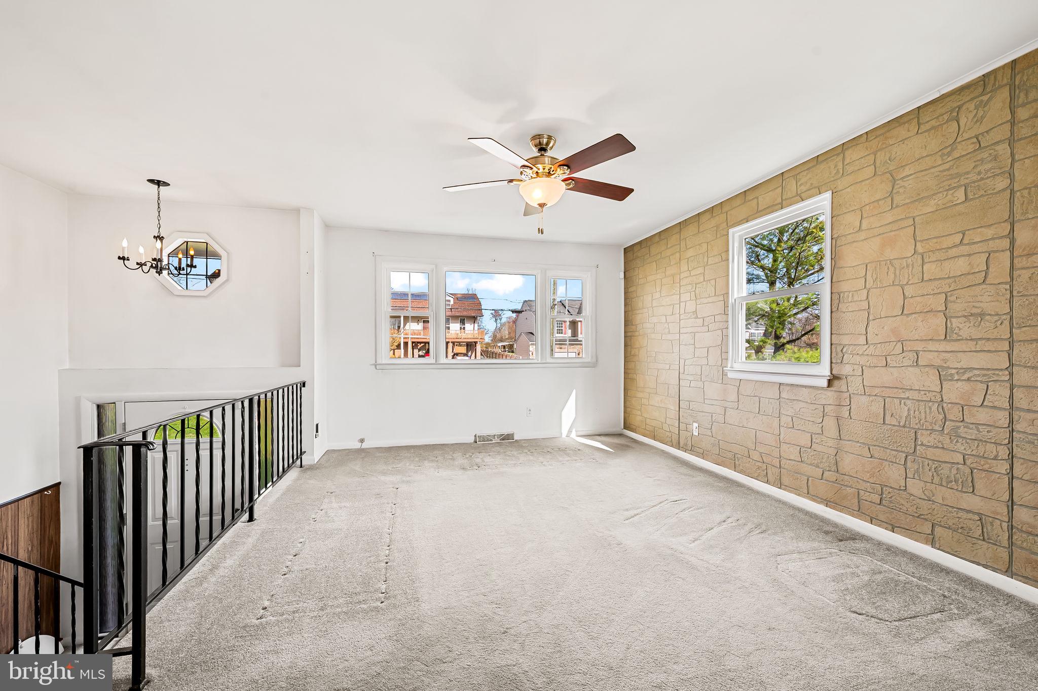 9382 North Laurel Road Laurel, MD 20723 - Photo 5 of 31 an empty room with windows and fan
