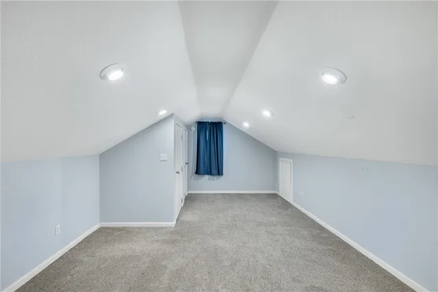 a view of an empty room with a chandelier