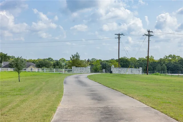 a view of a golf course with a lake