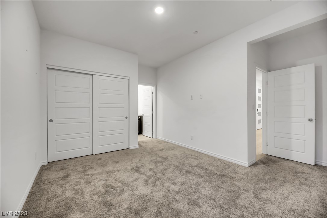 291 Robson Rdg Lane Henderson, NV 89015 - Photo 12 of 77 Next Gen Bedroom with Carpet and Private Bath