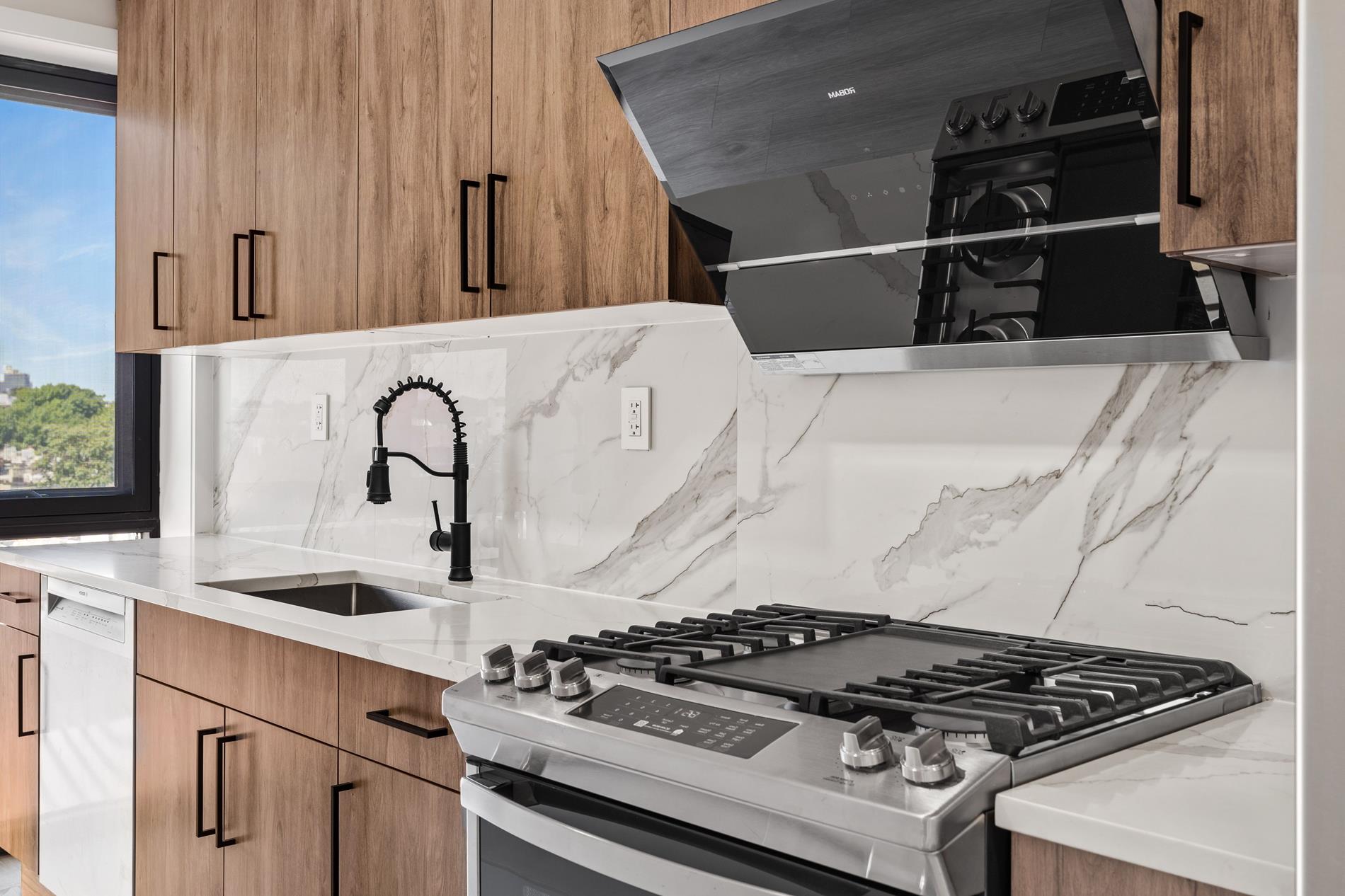 1546 Broadway, Unit 6B Brooklyn, NY 11233 - Photo 2 of 13 a close view of a stove top oven and sitting space