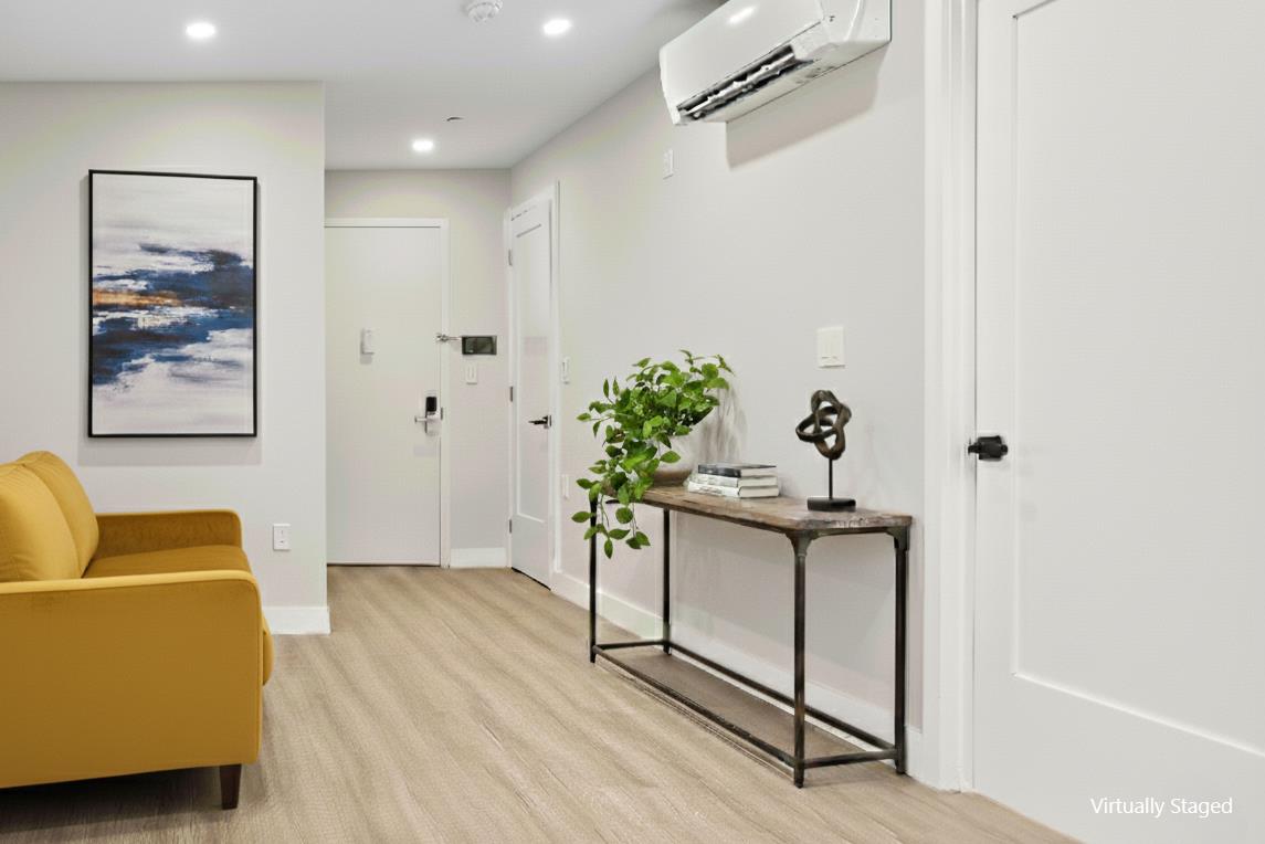 1546 Broadway, Unit 6B Brooklyn, NY 11233 - Photo 3 of 13 a view of livingroom with furniture and wooden floor