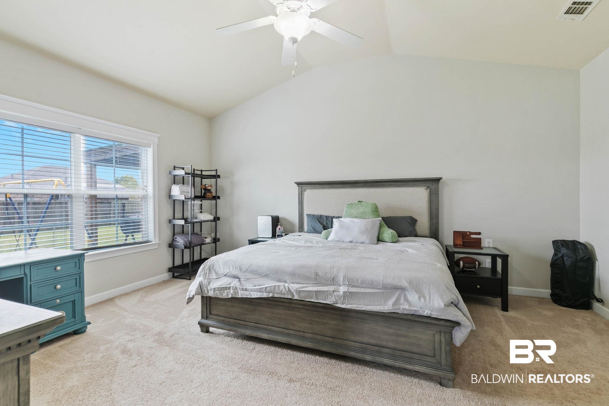 9177 Labrador Trail Theodore, AL 36582 - Photo 17 of 24 Bedroom featuring light colored carpet, vaulted ceiling, and ceiling fan