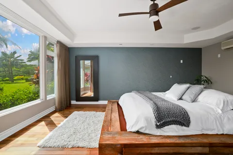 a bedroom with a bed and window