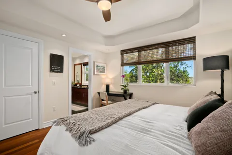 a bedroom with a large bed and a large window