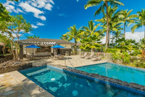 a view of a swimming pool with a patio