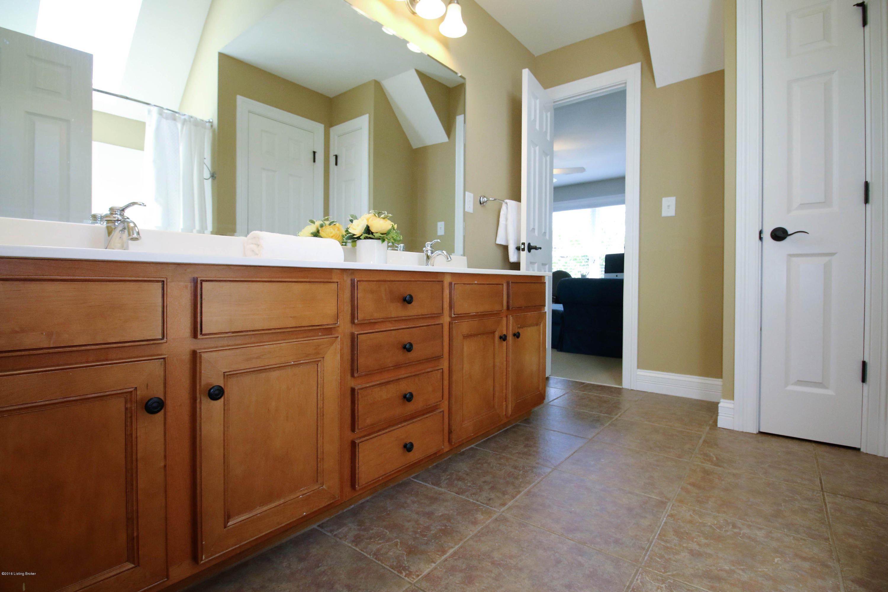 2904 Doe Ridge Court Prospect, KY 40059 - Photo 27 of 86 The hall bathroom features a dual sink vanity, plentiful counter space, and shiny chrome fixtures.