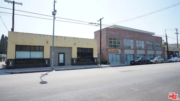 a view of a building with a street