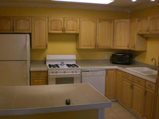 a kitchen with a sink and a refrigerator