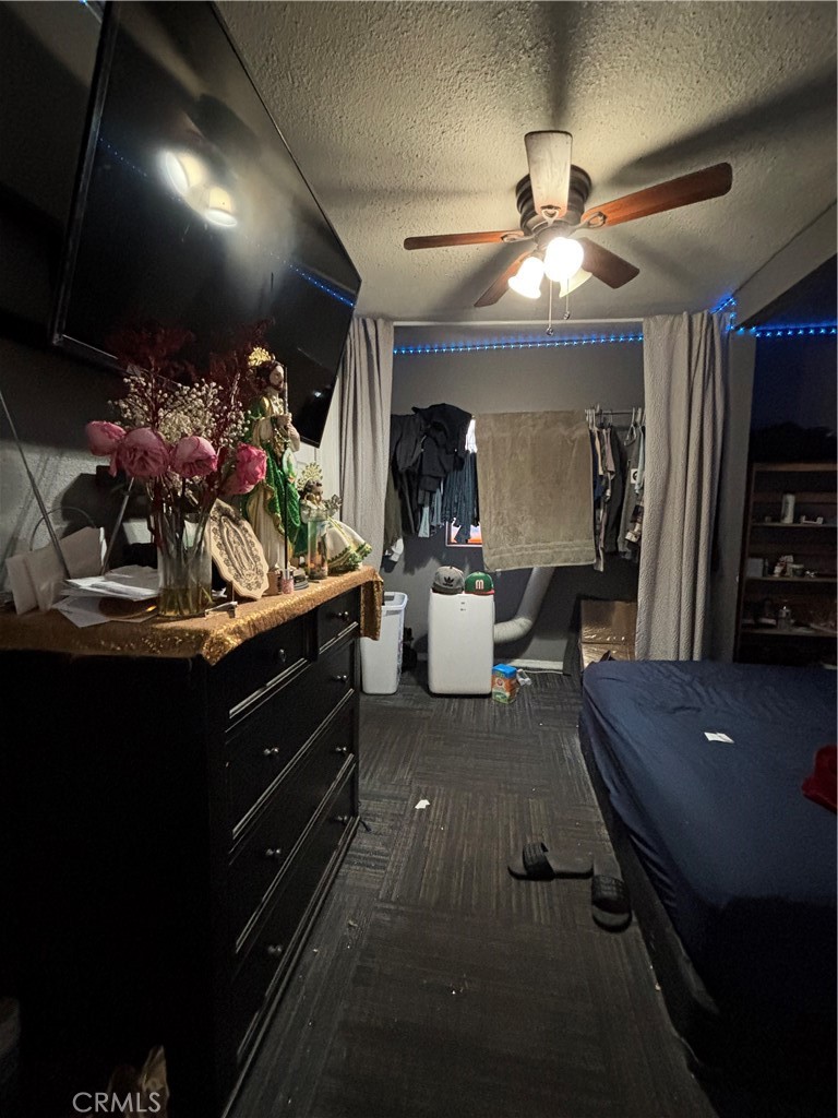 10821 Compton Los Angeles, CA 90059 - Photo 19 of 21 a living room with furniture and a flat screen tv