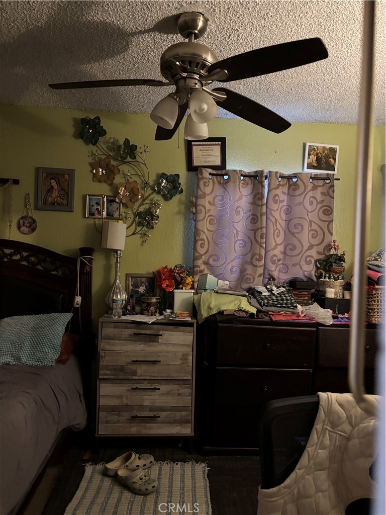 10821 Compton Los Angeles, CA 90059 - Photo 9 of 21 a living room with a couch and a stove