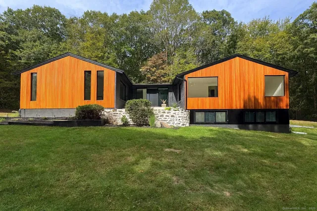 a backyard of a house with wooden fence