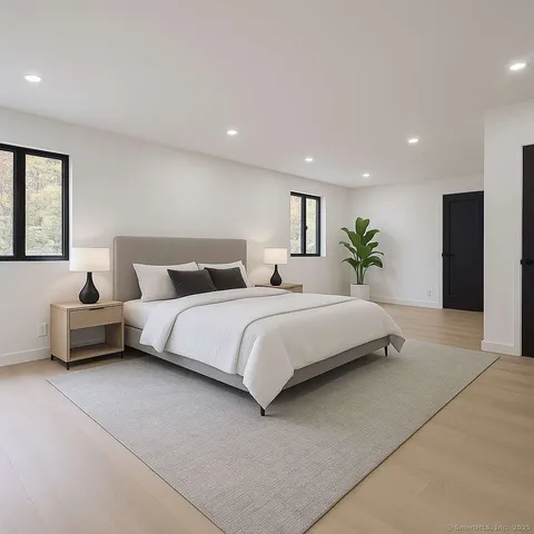 a bathroom with a white bath tub and a shower