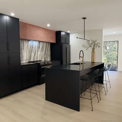 a view of empty room with a fireplace and window