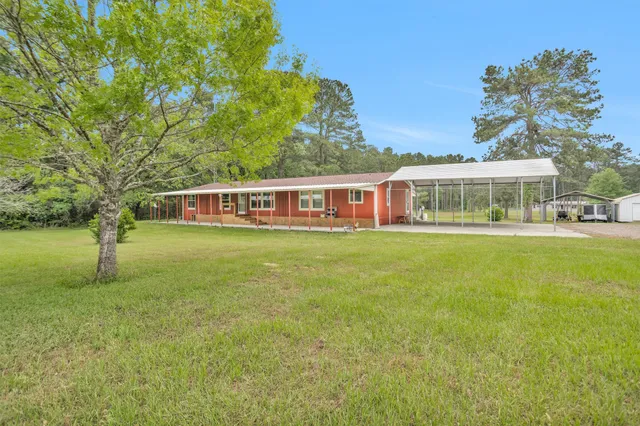 a view of a house with a big yard