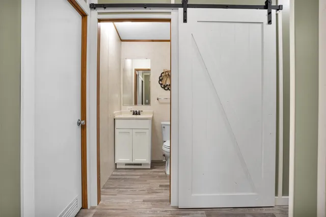 a view of a bathroom from the hallway