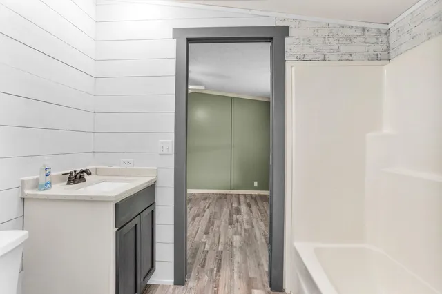 a bathroom with a sink and a bathtub