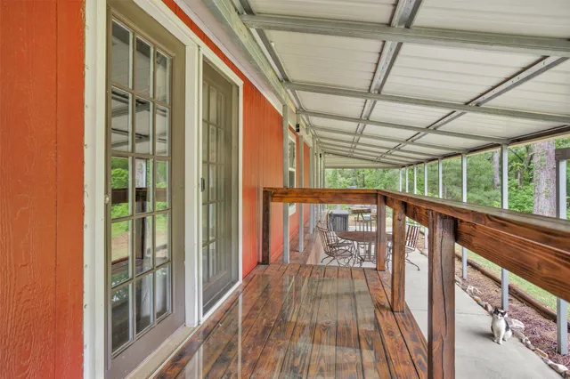 a view of balcony with wooden floor