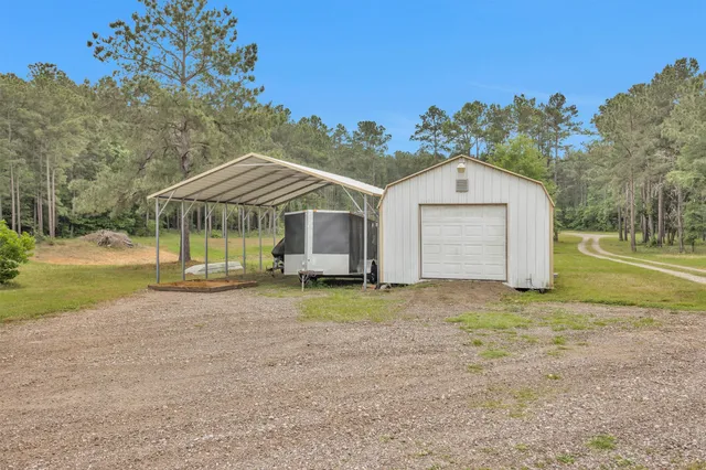 a view of a house with a yard and garage