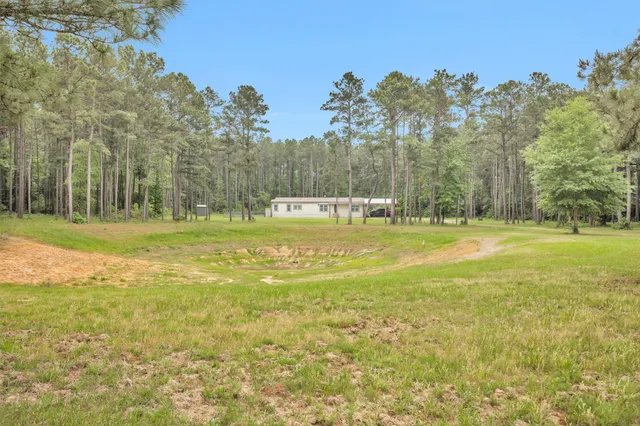 a view of a swimming pool with an outdoor space and seating area