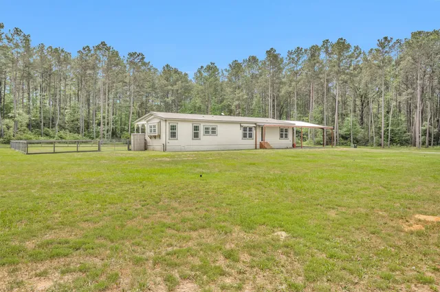 a view of a house with a big yard