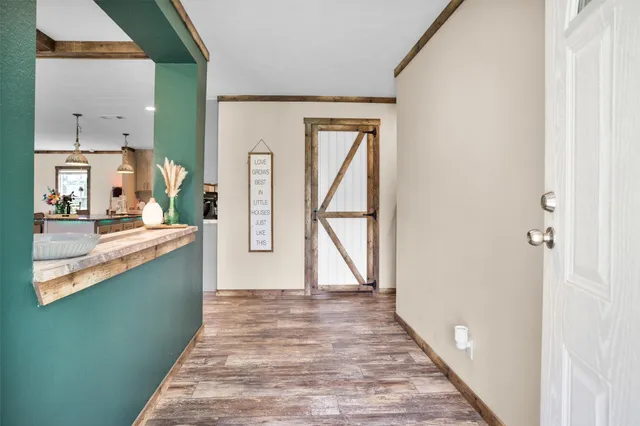 a view of a kitchen from the hallway