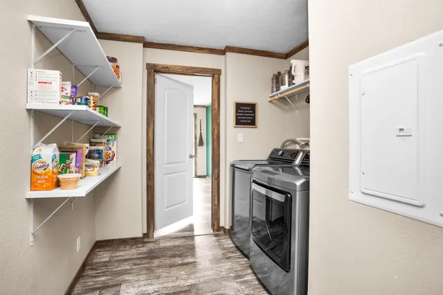 a hallway with a stove and a refrigerator