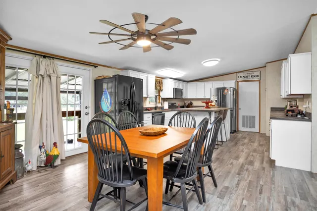 a view of a dining room with furniture window and wooden floor