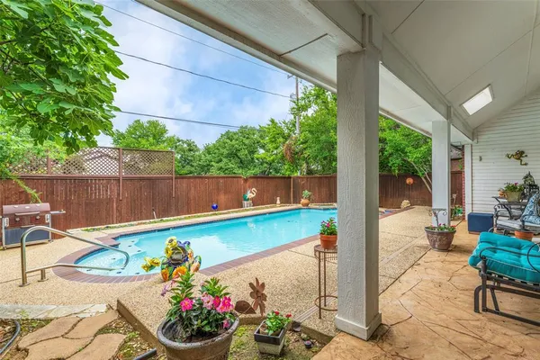 a view of swimming pool with a patio