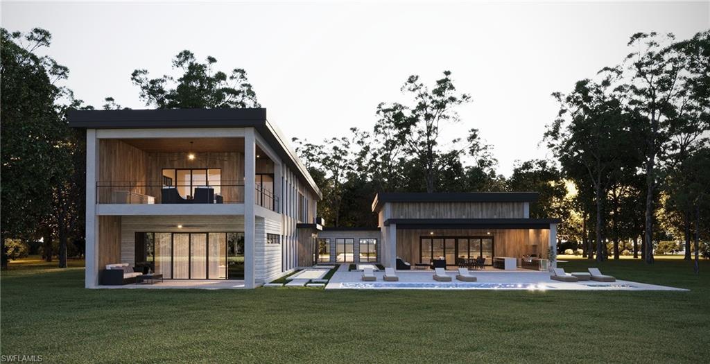 4696 3rd Avenue Northwest Naples, FL 34119 - Photo 11 of 11 a front view of a house with a yard