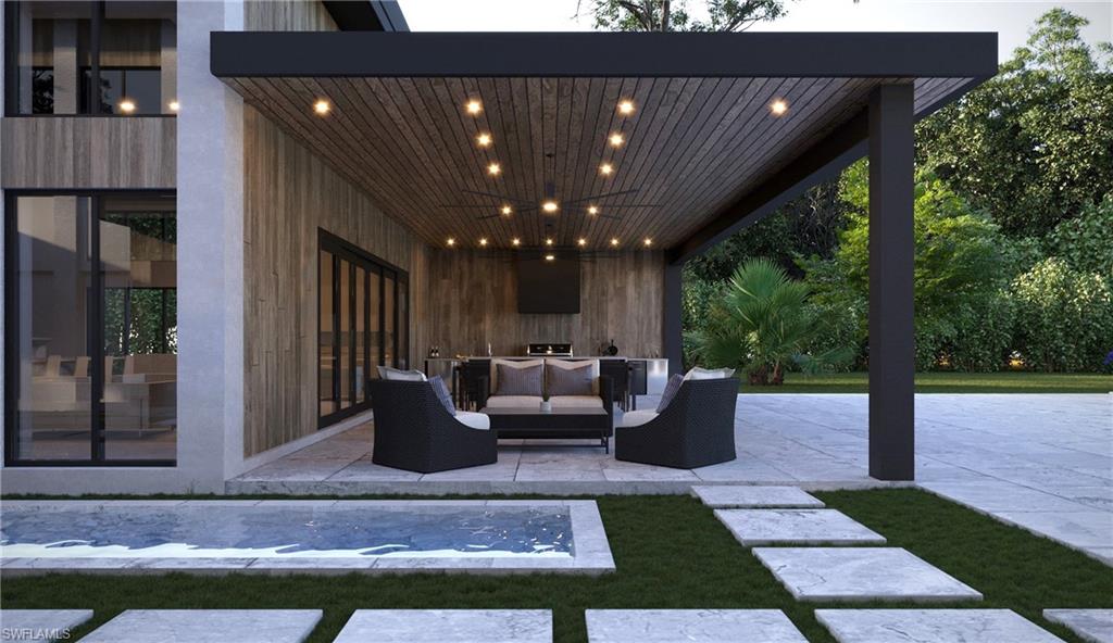 4696 3rd Avenue Northwest Naples, FL 34119 - Photo 9 of 11 a view of a patio with couches and dining table with garden view