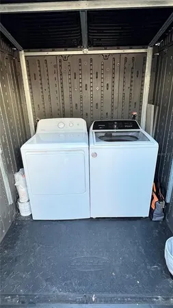 a utility room with washer and dryer