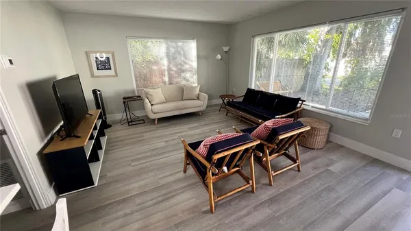 a living room with furniture and a window