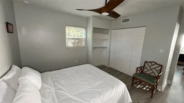 a bedroom with a bed and a dresser