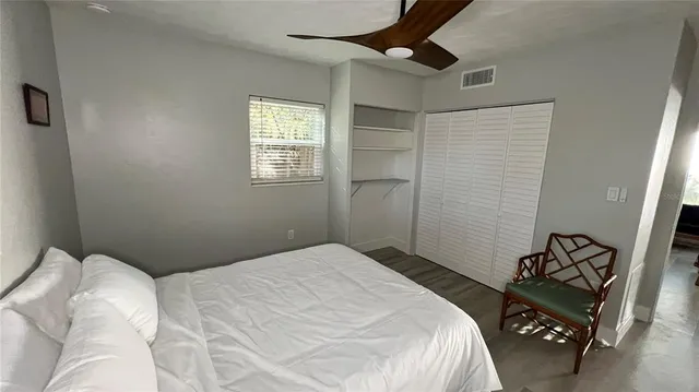 a bedroom with a bed and a dresser