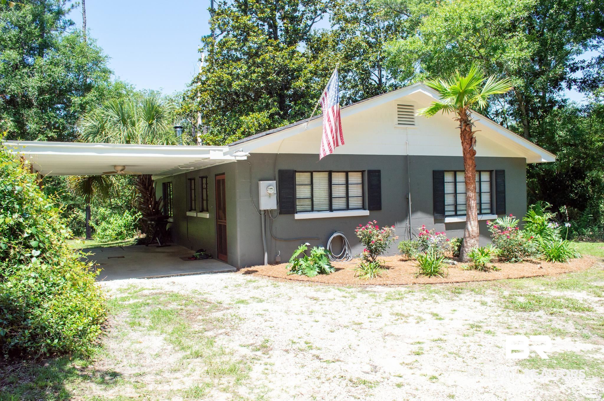 Single-story residence featuring a gray exterior with white trim