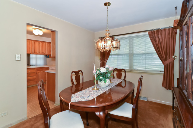 1326 Linden Road Homewood, IL 60430 - Photo 4 of 10 a view of a dining room with furniture and window