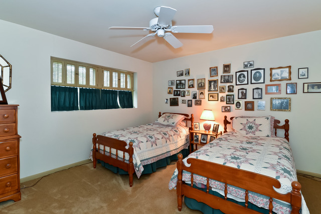 1326 Linden Road Homewood, IL 60430 - Photo 8 of 10 a bedroom with two beds and a bookshelf